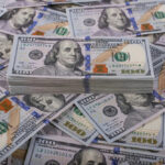 Stack of one hundred dollar bills, Benjamin Franklins portrait.