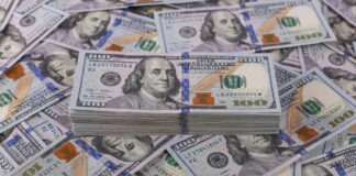 Stack of one hundred dollar bills, Benjamin Franklins portrait.