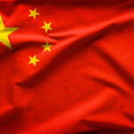 Red flag with five yellow stars, Chinas flag.