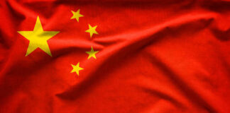 Red flag with five yellow stars, Chinas flag.