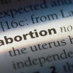 The word abortion highlighted in a dictionary page