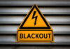 Yellow blackout warning sign with lightning bolt symbol