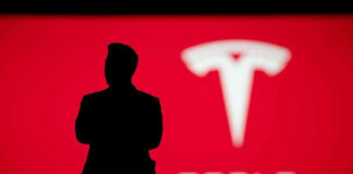 Silhouette with Tesla logo in red background.