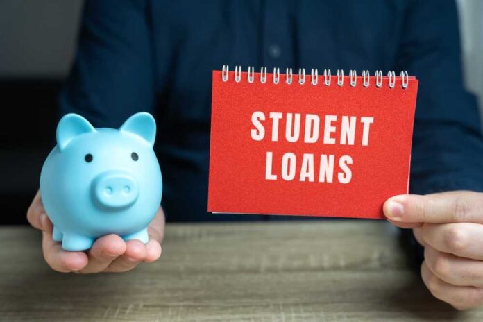 A blue piggy bank and a red notebook displaying 'STUDENT LOANS'