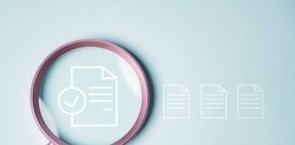 Magnifying glass focusing on a document with a checkmark