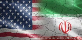 Flags of the United States and Iran blended together with a cracked texture