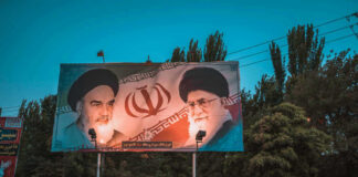 Billboard with portraits of two Iranian leaders.