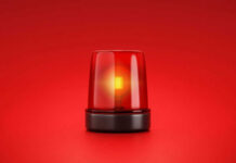 Red emergency light on red background