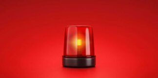 Red emergency light on red background