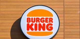 Burger King logo displayed on a wooden wall