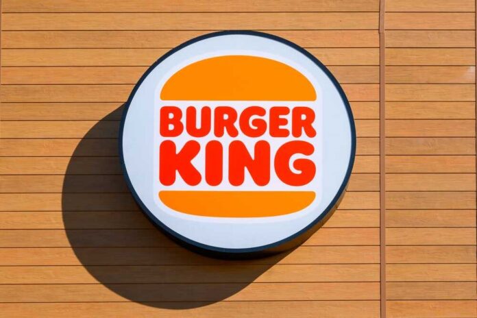 shutterstock_2169123213.jpg Burger King logo displayed on a wooden wall