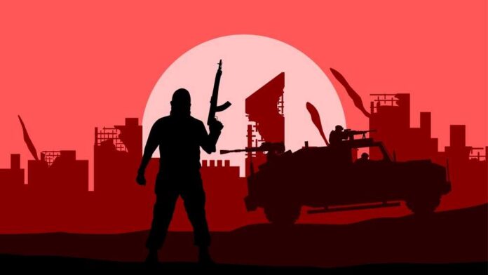 Silhouette of a soldier with a weapon against a red sunset and a military vehicle