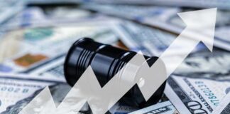 An oil barrel placed on a background of dollar bills with an upward trend graph overlay