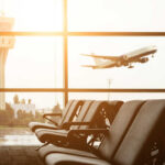 National Guard Threat Looms Over Airports View of an airport terminal with an airplane taking off in the background