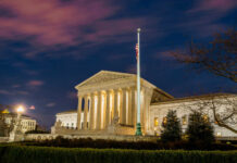 The United States Supreme Court building at dusk.