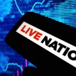A mobile device displaying the Live Nation logo against a digital background