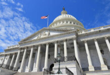 Senators’ Pay Delay: Real Reform or Pure Symbolism? US Capitol building with American flag and columns