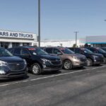 Used-Car Price Wall Finally Cracks Row of used cars for sale at a dealership with price tags displayed