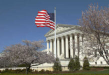 Emergency Supreme Court Appeal – Drugmakers Fight Back U.S. Supreme Court building with an American flag and cherry blossom trees