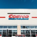 Exterior view of a Costco Wholesale store with shopping carts in front