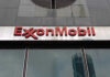Oil Price Warning From Exxon ExxonMobil logo displayed on a glass building