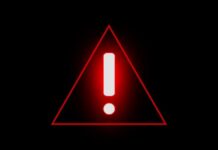 Red warning triangle with exclamation mark on black background