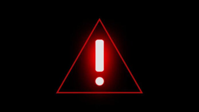 Red warning triangle with exclamation mark on black background